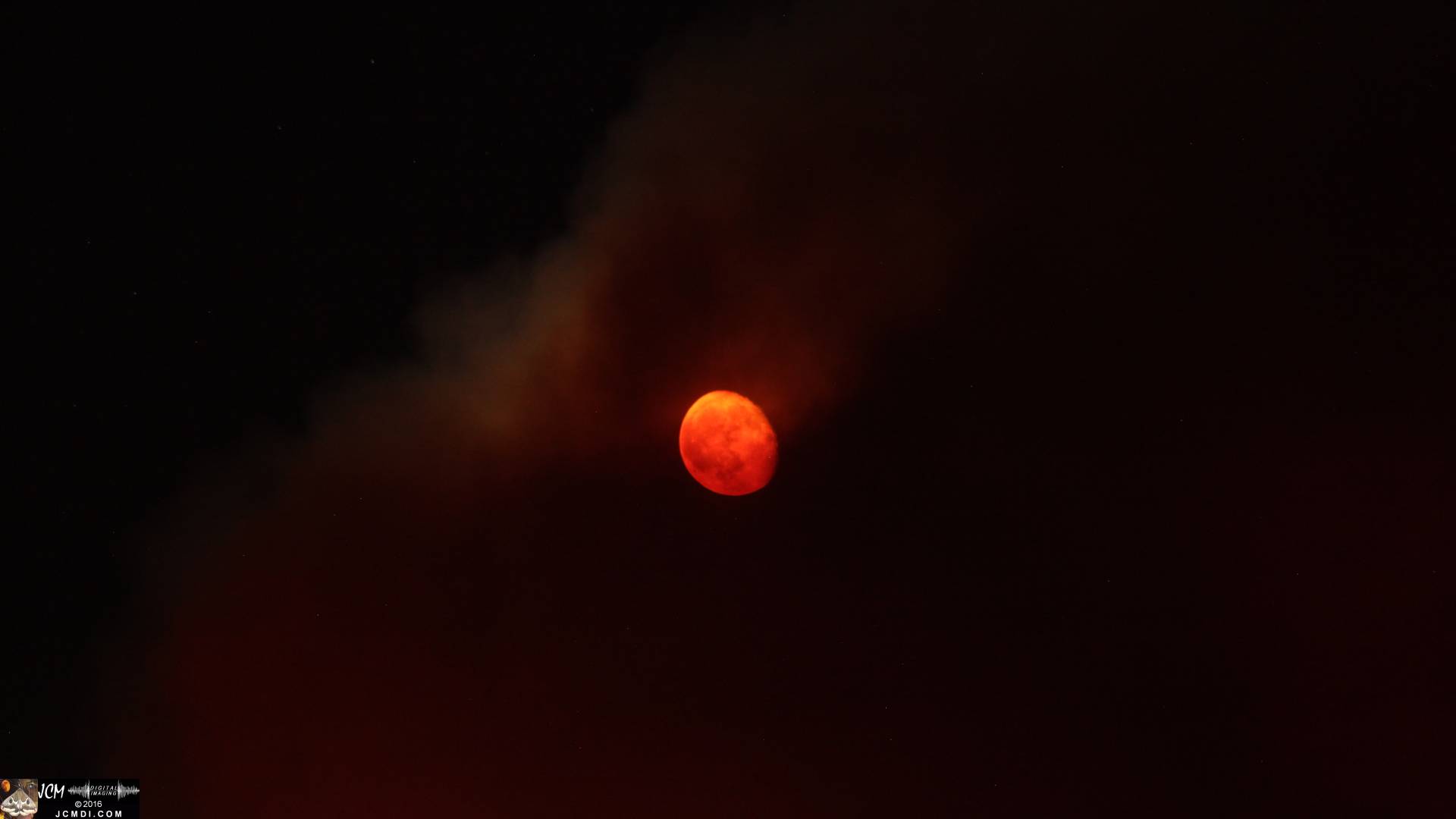 Sand fire long-exposure night image with bloody moonrise JCMDI.COM